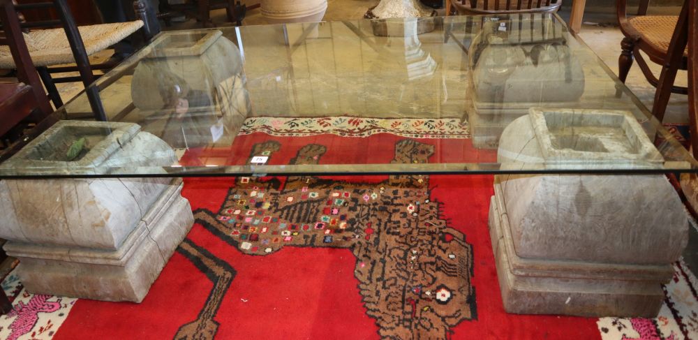 A rectangular bevelled glass top coffee table on four Indonesian bleached wood supports, W.152cm, D.106cm, H.37cm